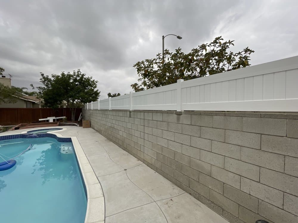 Vinyl privacy fence installation from the Empire Fence project gallery