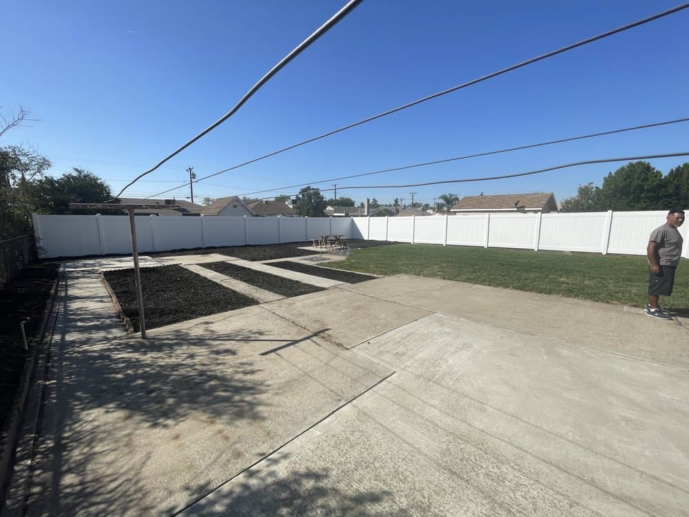 White vinyl fence installation from the Empire Fence project gallery